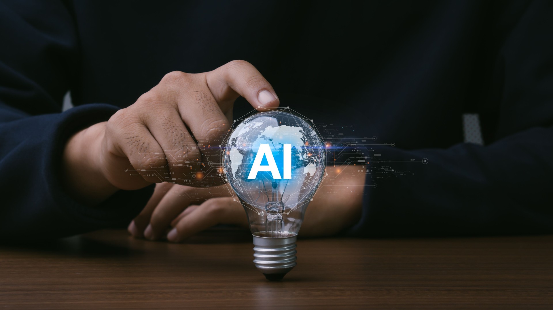 AI (Artificial intelligence) growing concept. Businessman hand holding light bulb with AI word, futuristic technology idea.
